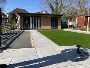 Laying the artificial grass in progress