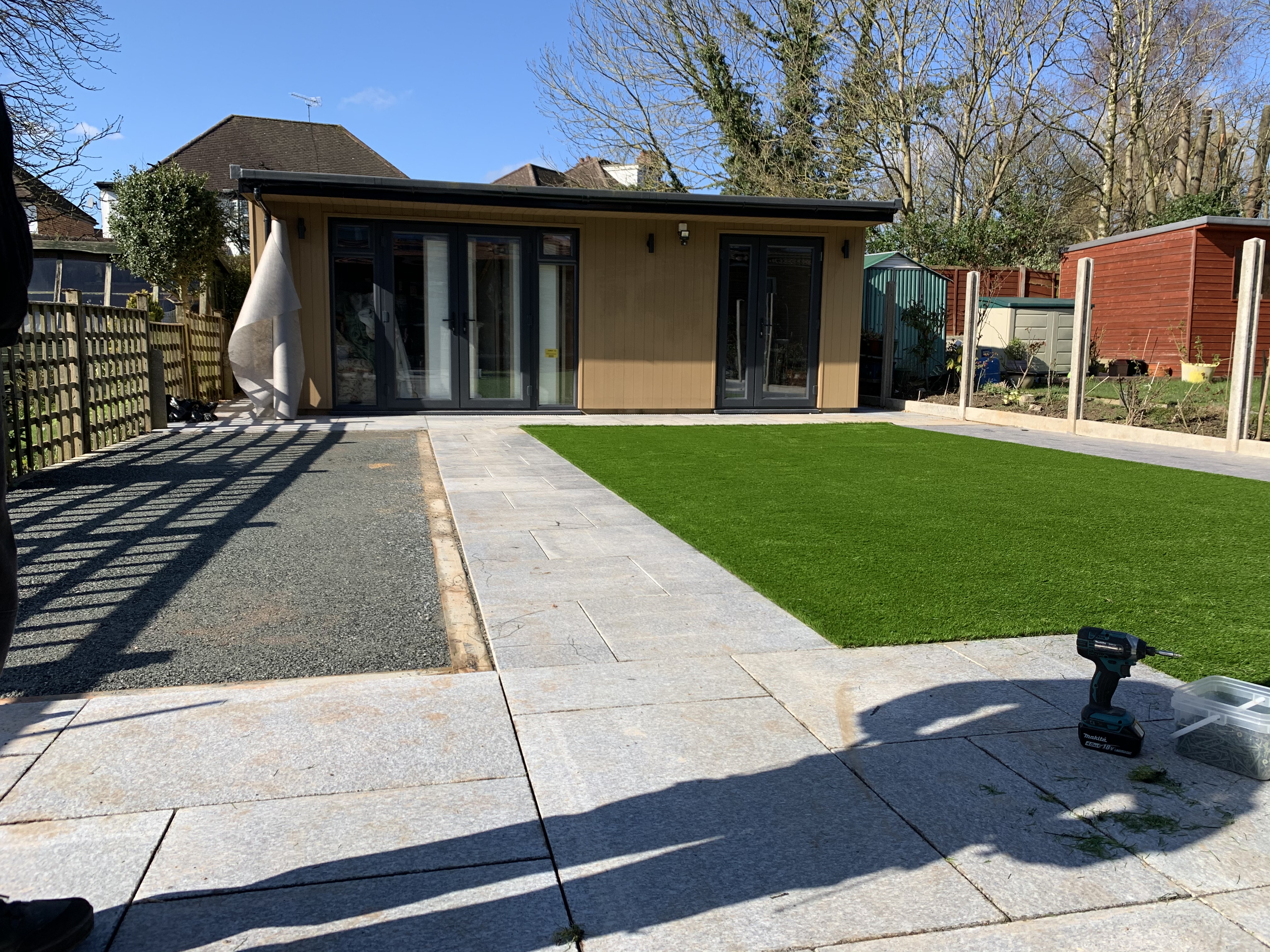 Laying the artificial grass in progress